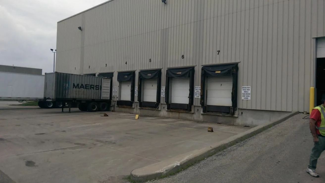 Container on a chassis backed up to the loading docks at the KDM Logistics warehouse in Mississauga, where freight is staged before heading out across Canada