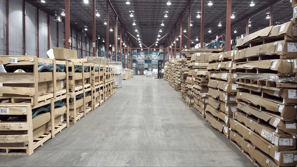 Crated freight staged in warehouse aisles